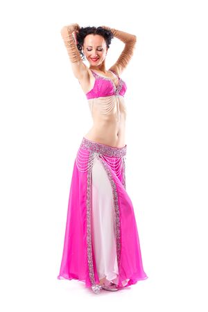Sensual arabic girl belly dancer dancing in studio. Belly dance movement in actionの写真素材