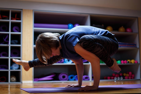 Young attractive woman practicing yoga, stretching. Young Woman Practicing Yogaの写真素材
