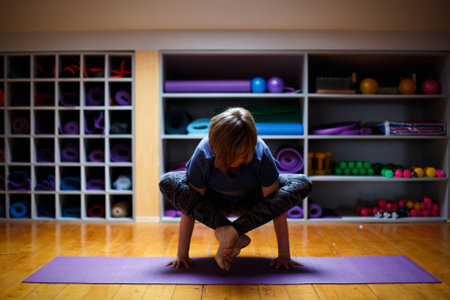 Fitness girl doing yoga exercises in the gymの写真素材