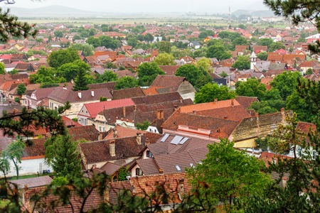 Top view to red tile roofs city. Background of old roof tilesの写真素材