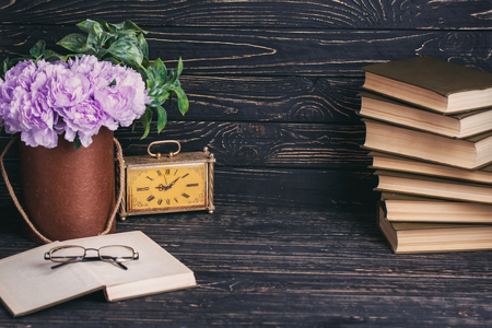 Educational background. Composition from books, old watche, flowers and glassesの写真素材
