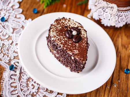 A piece of coffee cake with a white pearlの写真素材