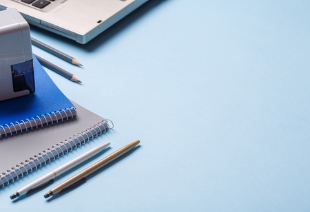 Desk in the auditorium. Background ready for your design. On a blue background. flat lay. copyspaceの写真素材