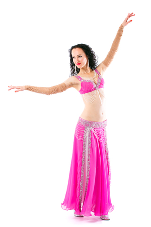 Wonderful brunette in the pink dress of an oriental dancerの写真素材