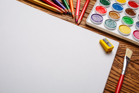 Bright paints along with the pencils and the albumの写真素材