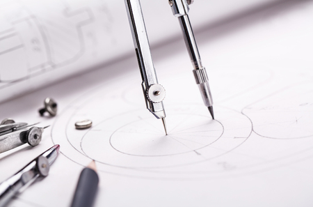 Compass drawing a circle on the drawingの写真素材