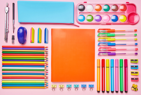 Bright composition from a school stationery on a pink background. Group of school supplies on table. Concept of education or back to school. Top view, Flat lay. copyspaceの写真素材