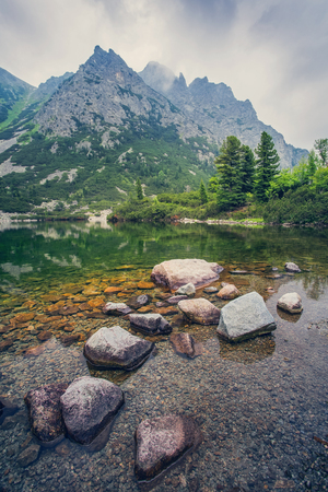 Popradske pleso - tarn in High Tatras mountains, Slovakia. Charming view of the mountains from the shore of the lake.の写真素材