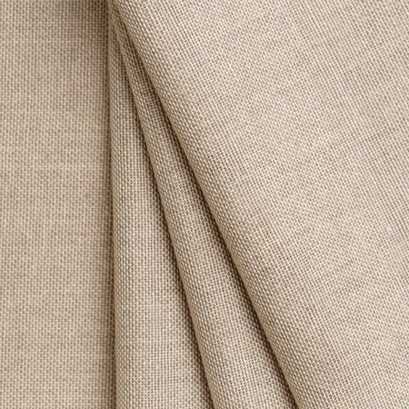 Texture canvas fabric as background. Texture fabric for feminine and men's shirts from flax. Allow your skin to breathe freelyの写真素材