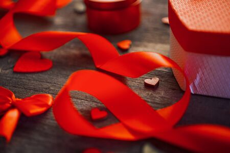 Love and holiday greeting concept background. Symbol of love. Red ribbon and heart decorの写真素材