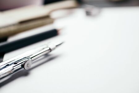 Compasses and Architect scale ruler placed on the desk,の写真素材
