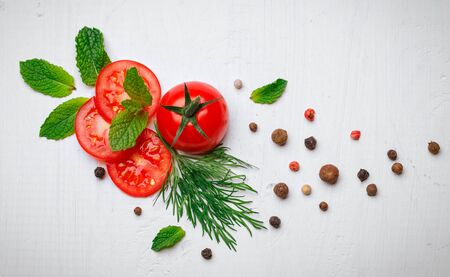 The composition is presented with tomatoes, mint, dill and pepper The composition is presented with tomatoes, mint, dill and pepper. Top view.の写真素材