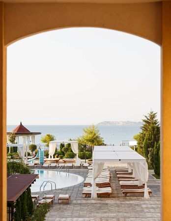 Relaxation area by the pool. Summer holiday in the hotel. Empty space for rest. Luxury place resort and spa for vacations, Sunny Beachの写真素材