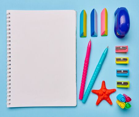 Group of school supplies lies on a light blue table. Stationery with copyspace. Concept of education or back to school. Top view, Flat lay. copyspaceの写真素材