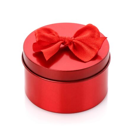 Single red gift box with red ribbon on white backgroundの写真素材