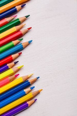 Bright color palette of crayons on the table. 1 September concept postcard, teachers day. Top view, flat lay. copyspaceの写真素材