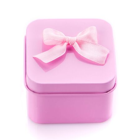 Single pink gift box with pink ribbon on white background. Top viewの写真素材