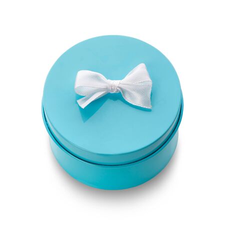 Turquoise gift box with white bow isolated on white. Top view. Clipping path included.の写真素材