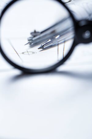 Compass on the background detail drawings. compasses and blueprint. selective focusの写真素材