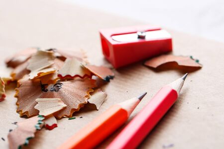 Red sharpener with pencils on the table. Concept of education or back to schoolの写真素材