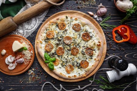 Mushroom pizza with herbs and mozzarella. Mockup.の写真素材