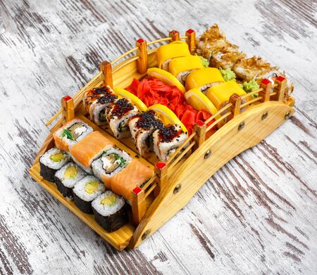 Sushi Set. Sushi rolls on wooden serving board Top view. Japan menuの写真素材