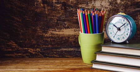 The background for your postcard is back to school. Education and wisdom concept. On a wooden backgroundの写真素材