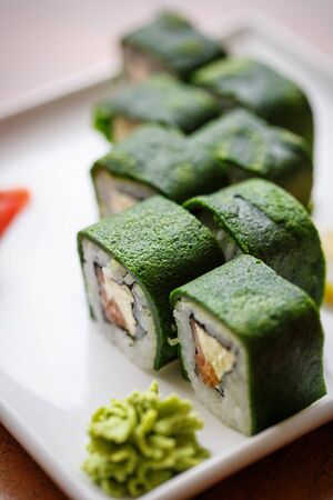 Japanese and Asian food. Green sushi are ready to serve. Concept for a tasty food and promotional flyer and poster for restaurants.の写真素材