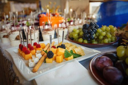 A bowl with different kinds of cheeses. Cold snacks. Buffet.の写真素材