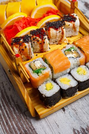 Japanese and Asian food. Sushi are ready to serve. Concept for a tasty food and promotional flyer and poster for restaurants.の写真素材