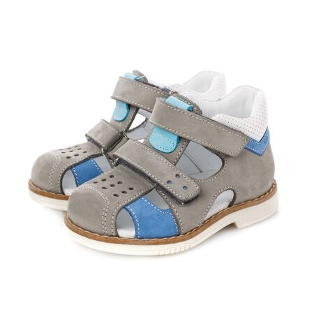 Gray suede sandals for the boy on a white background. Photo for shoes advertisement. Side viewの写真素材