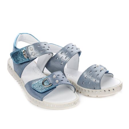Blue sandals for girls on a white background. Photo for shoes advertisementの写真素材
