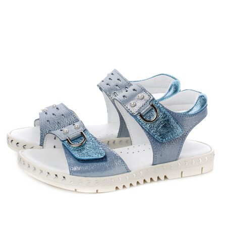 Blue sandals for girls on a white background. Photo for shoes advertisement. Side viewの写真素材