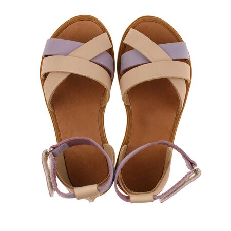 Beige sandals for girls with gray inserts on a white background. Photo for shoes advertisement. Top viewの写真素材