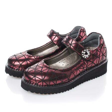 Children's dark red shoes for girls on a white background. Photo for shoes advertisement. Side viewの写真素材