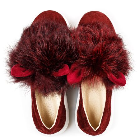Red suede shoes for girls with fur and ears on a white background. Photo for shoes advertisement. Top viewの写真素材