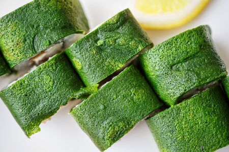 Japanese and Asian food. Green sushi are ready to serve. Concept for a tasty food and promotional flyer and poster for restaurants.の写真素材
