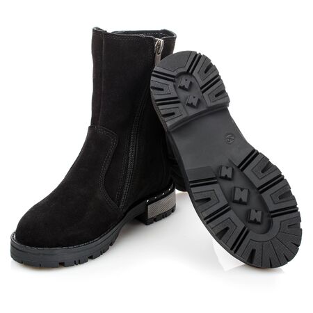 Black suede boots for girls on a white background. Photo for shoes advertisementの写真素材