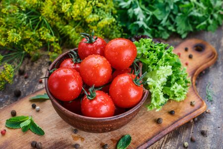 Ingredients for cooking sauce. Sprig tomatoes, with lettuce, peppercorns, ingredients, mint. Healthy eating concept. Healthy eating conceptの写真素材
