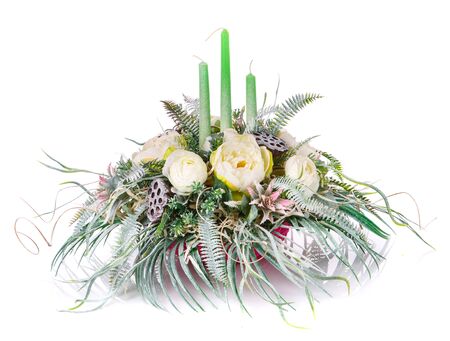 decoration with flowers and candles composition on a white backgroundの写真素材
