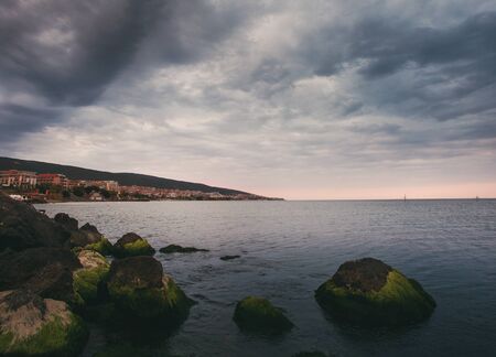 Time before the storm. Dramatic sky. Thunderstorm on the shore of a tourist city. The sea is preparing for a storm. Sveti Vlas, Bulgaria, Sunny Beachの写真素材