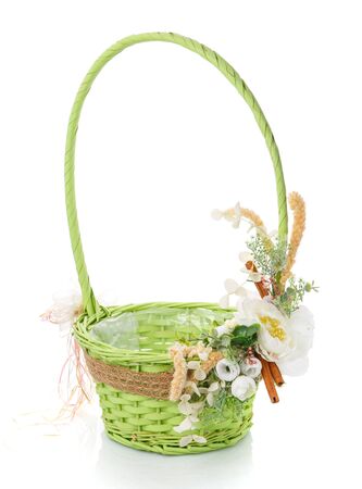 Decorative Easter composition. A vase stand, a bunny holds a composition of flowers.の写真素材