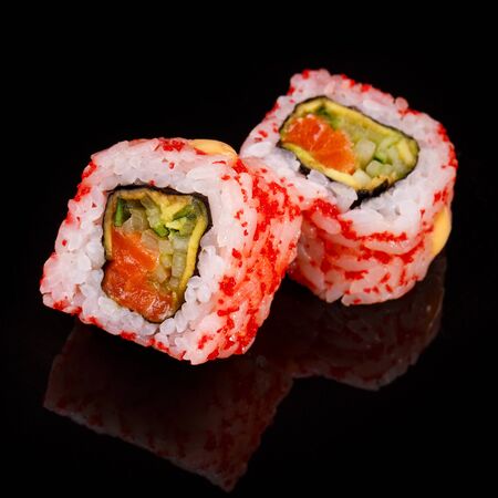 Two pieces of sushi closeup on black background. Macro shot of Japanese food.の写真素材