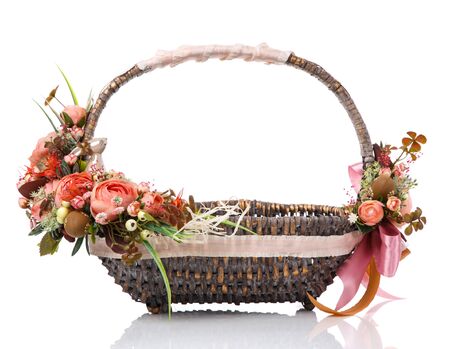 Beautiful decorative basket with flowers for Easter celebration, isolated on a white backgroundの写真素材