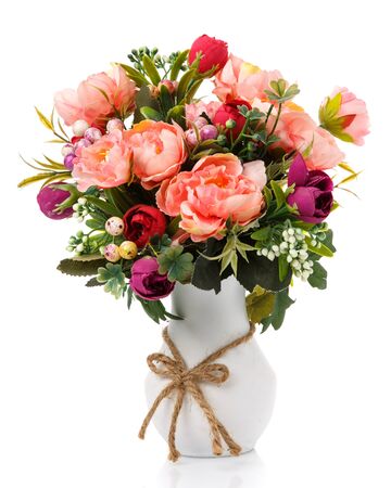 Big bouquet of pink flowers and greens in white small vase. Isolated. Home interior floral decor.の写真素材