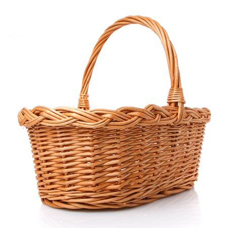 Big square brown wicker basket made of vines on a white background. Side view.の写真素材