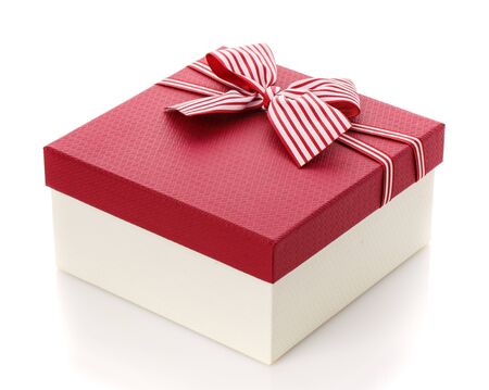Burgundy gift box with a beautiful bow on a white background. Side view.の写真素材