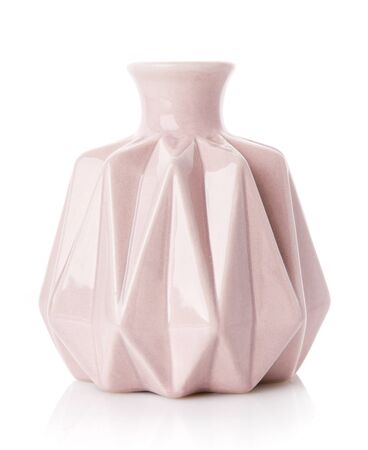 Decorative ribbed vase of pink color on a white background. Modern home decor.の写真素材