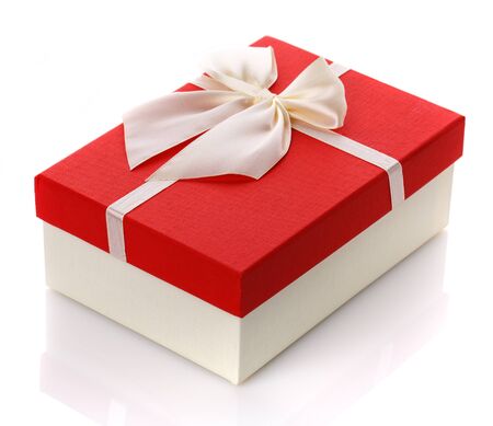 Gift box with big white bow. Isolated on white background. Surprise for the holidays.の写真素材
