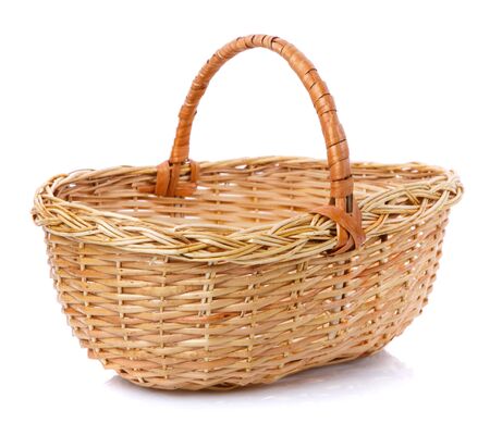 Oval brown wicker basket made of natural vine. Isolated. Handmade.の写真素材